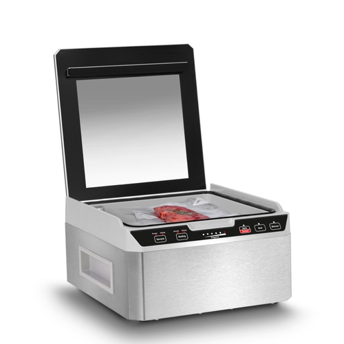 Vakuumiergerät mit Fleisch in einer Plastiktüte, bereit zum Versiegeln und Marinieren.